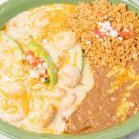 Seafood Enchiladas
 · Two (2)  Cheese enchiladas topped with shrimp, scallops & crawfish. Topped with a white wine...