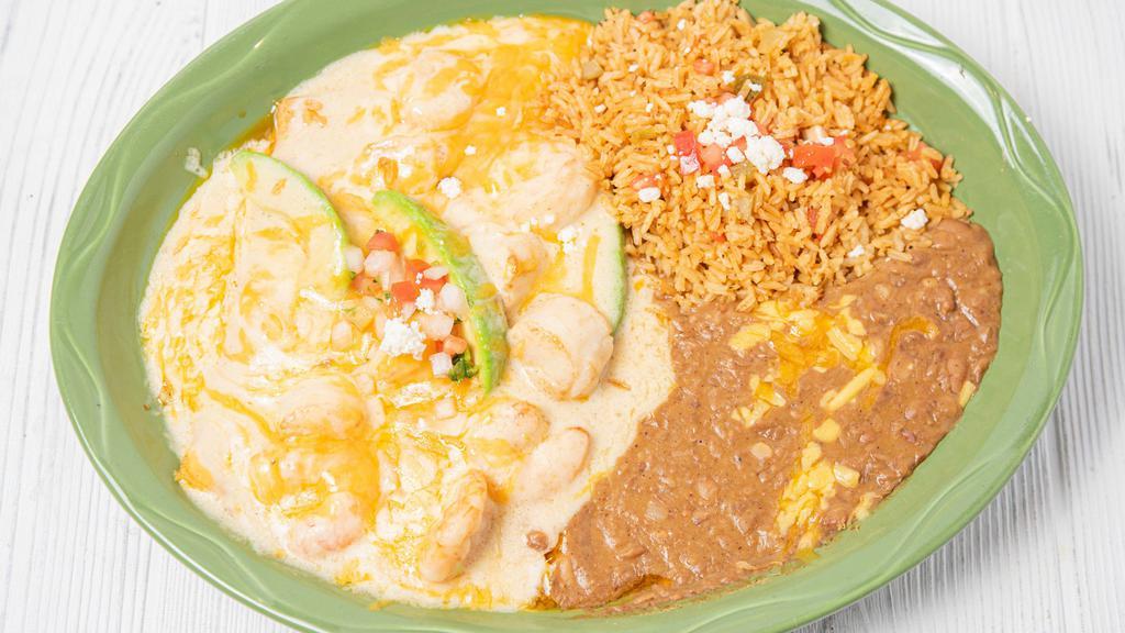 Seafood Enchiladas
 · Two (2)  Cheese enchiladas topped with shrimp, scallops & crawfish. Topped with a white wine cream sauce.