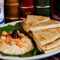 Hummus · served with hot fresh pita bread sub carrots or cucumbers for pita