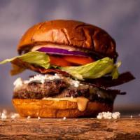 Spartan Burger · 10oz char grilled house patty | Brioche bun | onions | feta | Provolone | lettuce | tomato |...