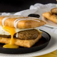 Sausage Egg & Cheese · Savory sausage crumbles scrambled eggs and shredded monterrey and cheddar jack cheese in a f...
