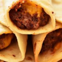 Fried Beef And Bean Burrito · Ground beef and pinto beans spiced to perfection with bell peppers chili crushed red pepper ...