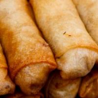 Egg Rolls · Egg roll full of delicious pork mixed in with cabbage celery and onion.