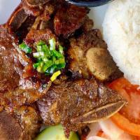 R6 Grilled Beef Short Rib  - Cơm Sườn Bó Đại Hàn · Steamed rice plate with grilled beef short rib, tomatoes, cucumber once served with signatur...