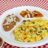Huevos A La Mexicana · Tres huevos revueltos con cebolla, tomate, jalapeños, acompañadoes con frijoles, papas y tor...