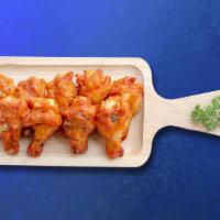 Bone-In Wild Wings (7 Pcs) · Bone-in chicken wings served with celery sticks and dressing.