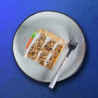 Carrot Cake  · Modern carrot cake with white cream cheese frosting with pecan nuts and premium almonds.