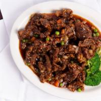 Spicy Crispy · Spicy. Fried until crispy and stir-fried with onions, peas, and carrots in a spicy garlic sa...