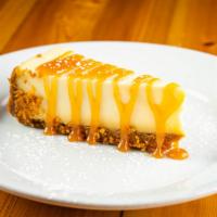 Cheesecake · New york style cheesecake with a caramel drizzle.