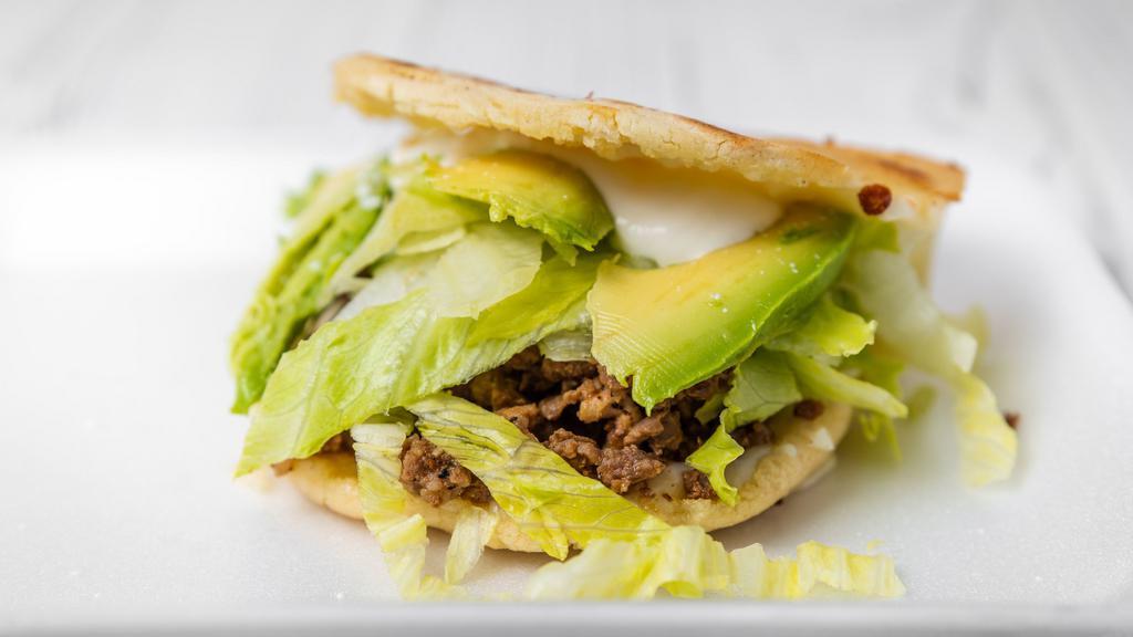 Gorditas · Two handmade corn covers with cheese and meat of choice topped with lettuce, tomato, avocado, and Sour cream