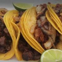 Corn Taco · Corn torilla with meat of choice topped with Raw onions and cilantro
