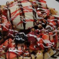 Alaskan Waffle · Candied pecan waffle with all the berries topped with vanilla flavored ice cream, white choc...