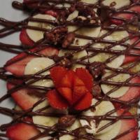 Banana Strawberry Nutella Crepe · Topped with bananas, strawberries and Nutella.