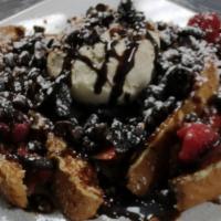 Strawbanana Nutella French Toast · Strawberries, bananas topped with Nutella. Dusted with powdered sugar.