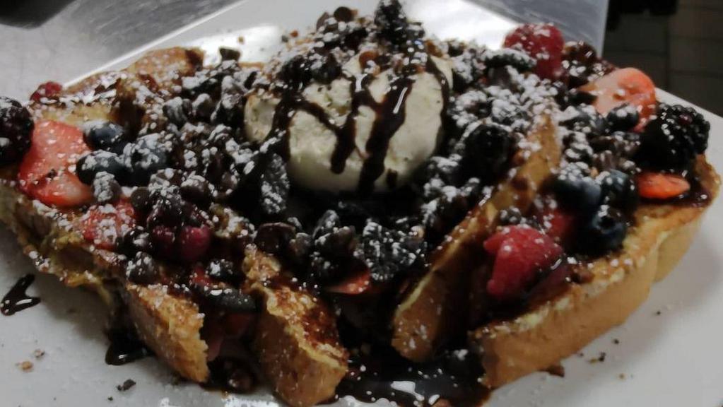 Strawbanana Nutella French Toast · Strawberries, bananas topped with Nutella. Dusted with powdered sugar.