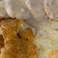 Country Breakfast · Two eggs any style served with hash browns and country gravy ladled over flakey biscuits.