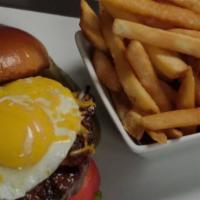 Royal Burger · Cob smoked bacon, Jack cheese, mayo, topped with sunny-side egg on a toasted brioche bun.