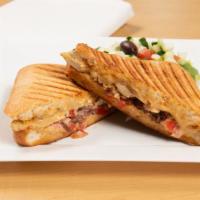 Chicken Panini · Grilled chicken breast, roasted red peppers, tomato, spinach, feta cheese and pesto mayo.