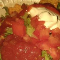 Taco Salad · Comes with chips, taco meat, lettuce, tomato shredded cheddar cheese, taco sauce, and sour c...