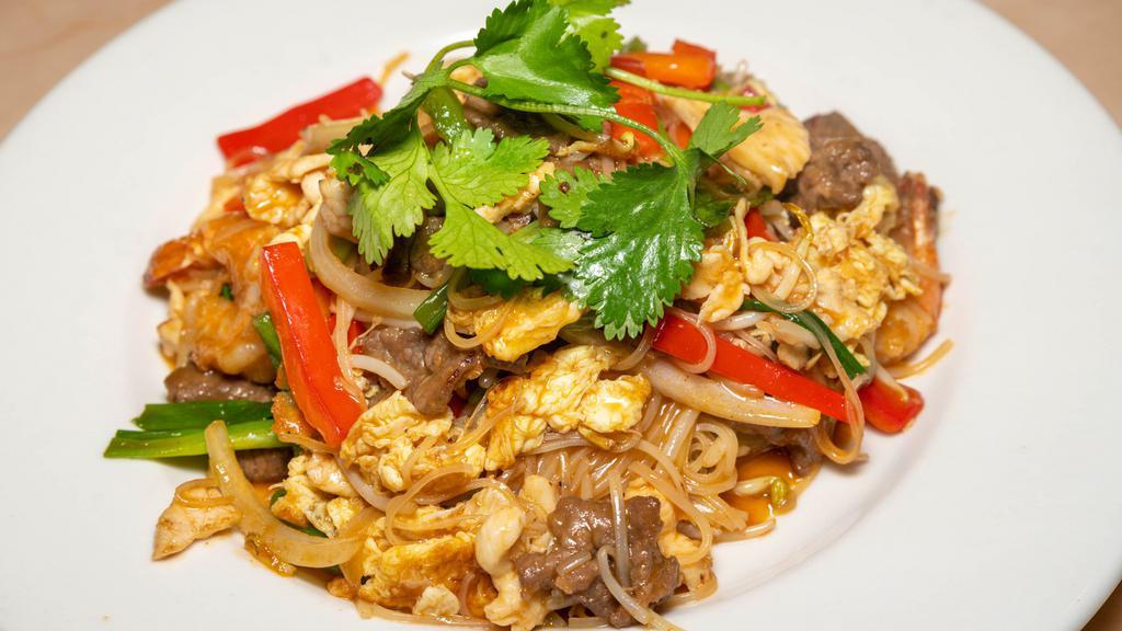 Pad Thai · Stir fried noodles with beef, chicken, shrimp, egg, green onion, bean sprouts, and ground peanuts.