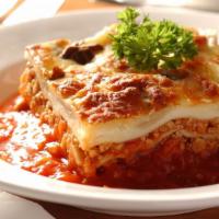 Homemade Lasagna · (5) High layers of Ground Beef, Ricotta, Mozzarella, and Tomato Sauce.