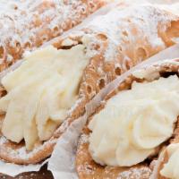 Cannoli · Pastry tube filled with sweet ricotta cream, chocolate, and powdered sugar.
