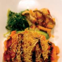 Spicy Salmon Don · Rice bowl with raw salmon marinated with spicy sauce, served with seaweed salad, crispy onio...