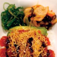 Tekka Don · Rice bowl with sushi-grade raw ahi tuna marinated with spicy sauce, served with squid salad,...
