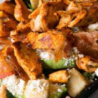The Standard Chicken Salad · Marinated chicken breast and grilled onions with romaine, tomatoes, cucumbers and cheddar ch...