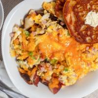 Farmers Skillet · Seasoned home fries, ham, crumbled sausage, onions, bell peppers, topped with cheddar cheese...
