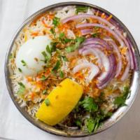 Hyderabadi Chicken Biryani · Chicken cooked in basmati rice with special herbs and spices.