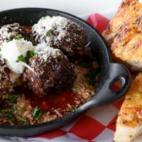 House Meatballs · Ground chuck and pork, Italian herbs, ricotta, herb focaccia, and lots of cheese.