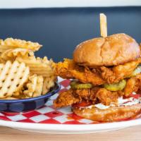 Pressbox Hot Chicken · Calabrian chile glazed fried chicken, horseradish pickles, tomato, dill dressing, and sesame...