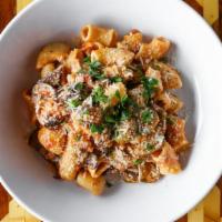 Rigatoni Alla Vodka · Housemade sausage, roasted peppers, ricotta, and garlic breadcrumbs.