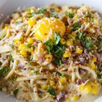 *Roasted Corn Carbonara · Spaghetti, bacon, roasted corn, pecorino, garlic breadcrumbs, and egg. *Consuming raw or und...