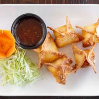 Crab Rangoon (5) · 5 pcs Fried wontons filled with crabmeat and cream cheese with sweet & sour sauce.