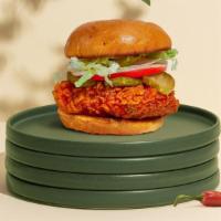 Spell Spicy Chicken Sandwich · Crispy fried chicken, sliced tomatoes, shredded lettuce, jalapenos, and hot sauce. Served on...