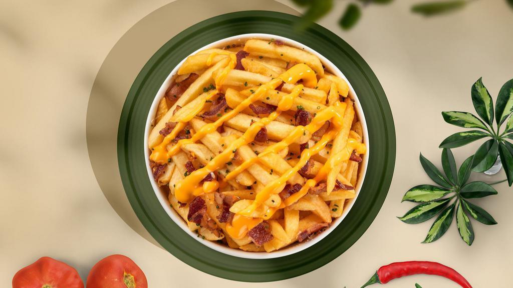 Baconator Loaded Fries · Idaho potato fries cooked until golden brown and garnished with salt, melted cheddar cheese, and bits of crispy bacon.