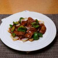 Pepper Steak · Slices of tender beef sauteed with fresh green pepper and onions in black bean garlic sauce.