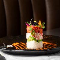 Ahi Tower · Blue-fin tuna (or salmon), avocado, crab meat and sushi rice served with eel and spicy mayo ...