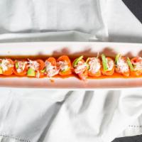Butterfly Kiss (12) · Crab salad, avocado wrapped in fresh salmon sashimi served with ponzu sauce. No rice, no sea...
