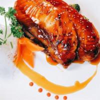 Salmon Cake · Salmon wrapped around crab salad and cream cheese mix baked with tobiko, scallions and eel s...