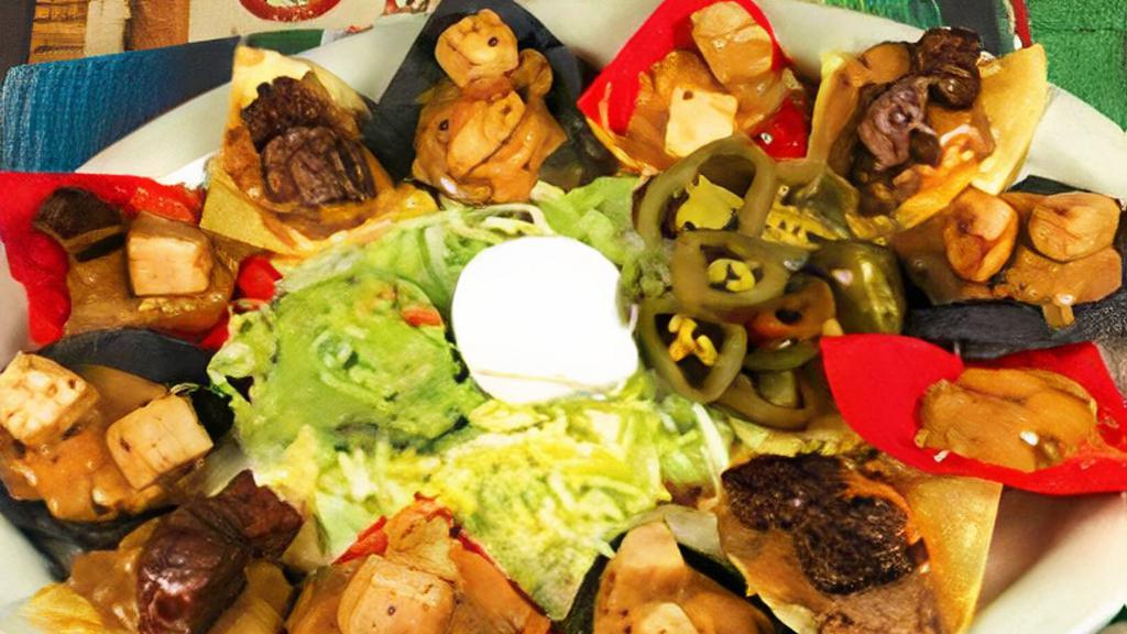 Nachos Al Carbon · 12 pieces. Grilled beef or chicken fajitas, beans and cheese, guacamole, and sour cream on the side.