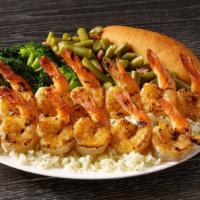 Grilled Shrimp Skewers Meal · Plump seasoned shrimp that are seared to perfection over a bed of rice. Served with a breads...