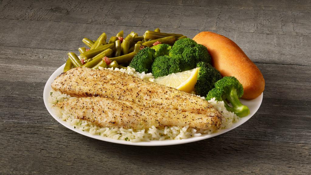 Lemon Pepper White Fish Meal · A fillet of our tender and flaky white fish, seasoned with pepper and tangy lemon. Served on a bed of rice with your choice of two sides and breadstick.