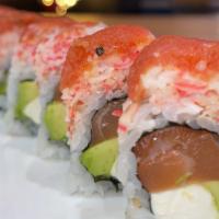 Charming Roll · Spicy,Raw. 

Salmon, cream cheese, avocado, jalapeno topped with crabmeat, spicy tuna, spicy...