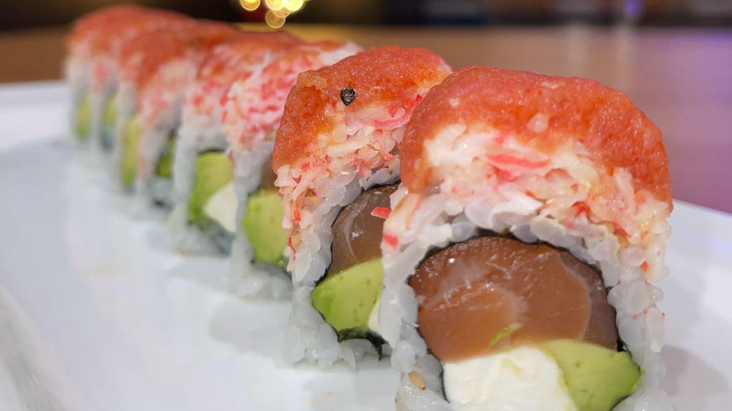 Charming Roll · Spicy,Raw. 

Salmon, cream cheese, avocado, jalapeno topped with crabmeat, spicy tuna, spicy mayo and eel sauce.