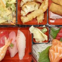 Sushi &Sashimi Bento · Raw. 

Served with 5 pcs Sushi (Chef's Choice) + 6 pcs Sashimi (Tuna 3 pcs, Salmon 3 pcs)