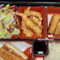 Chicken Cutlet Bento · Cooked. 

Deep fried chicken with white rice and sweet sauce