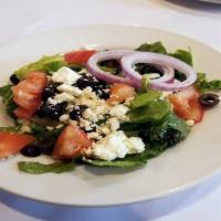 House Salad · Mixed salad greens tossed with our feta vinaigrette dressing, topped with roma tomatoes, bla...